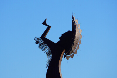 Keeper of the Plains against a blue sky