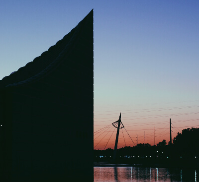 Wichita sunset sillouetting Exploration Place and bridge